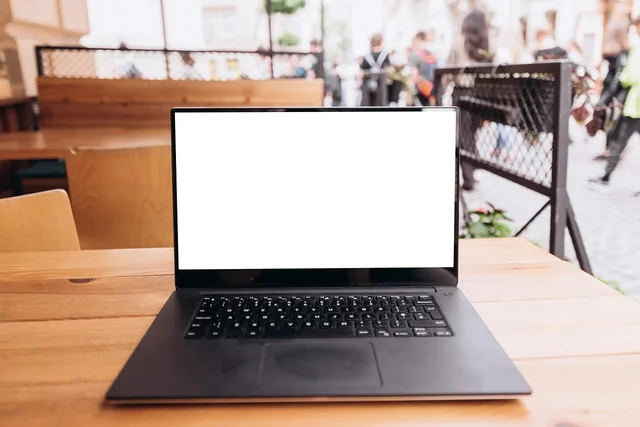 laptop, workplace, coffee shop, white screen, copy space, blank space, mockup, monitor, screen, device, portable, pc, modern, computer, workspace, table, cafe. Check how SAAS marketing UK regulations shape your campaign plan